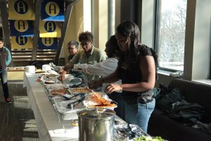 The BSU executive board sets up the food for the Thanksgiving meal. Photo by LuAnna Gerdemann.