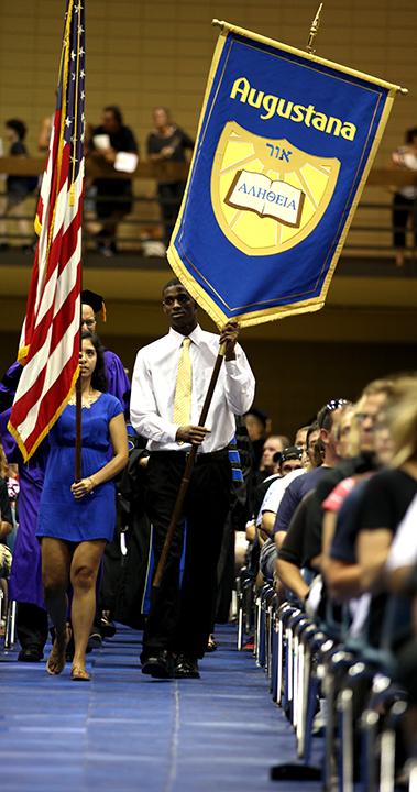 Senior Michelle Bautista and junior Tayvian Johnson lead the procession during the 155th opening convocation.