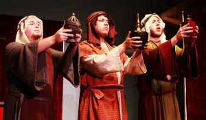 Tom Hagaman, Corbin Delgado and Payton Brasher present their gifts in "The Play of Herod." The collection of manuscripts used is known as the Fleury Playbook, and is among the most comprehensive notation for early liturgical musical material from around 1200 A.D. Photo credit: Shylee Garrett/Observer Staff