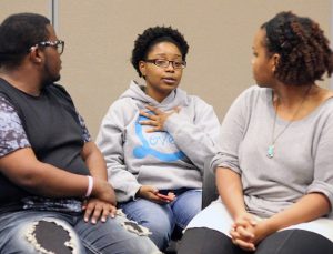 Briana Brown expresses her opinion of the events in Ferguson last Monday. Students and faculty gathered to show their commitment to diversity and understanding. Photo by Linnea Ritchie