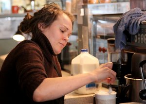  Barista Amanda Olson prepares an order. Olson works at Theo’s Java Club, which served as the coffee shop in Augustana’s library for 11 years. Photo by Sarah Ritter.