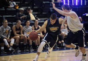 Members of the men's basketball team play against each other in a scrimmage. Photo by LuAnna Gerdemann.